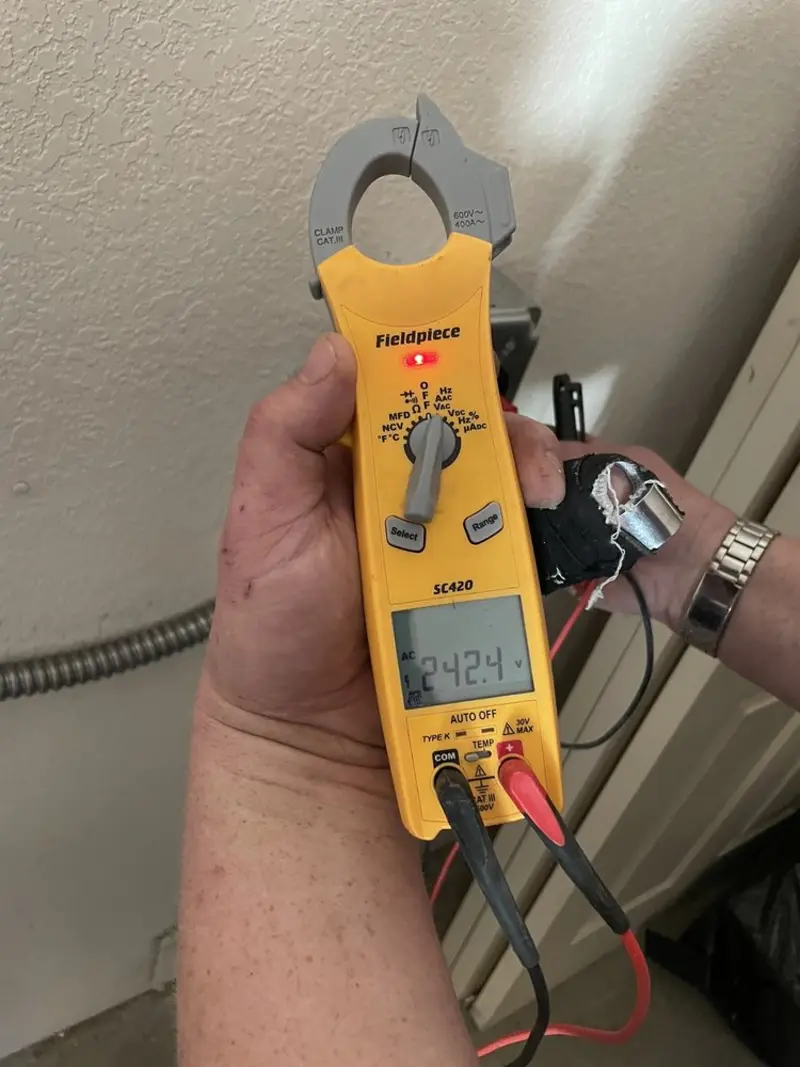 Voltage testing with clamp meter during Generator Installation in Fort Campbell North